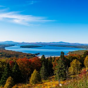 Overlook view from Height of Land in Western Maine with Mooselookmeguntic Lake and surrounding fall foliage.